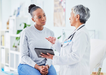 woman speaking with doctor